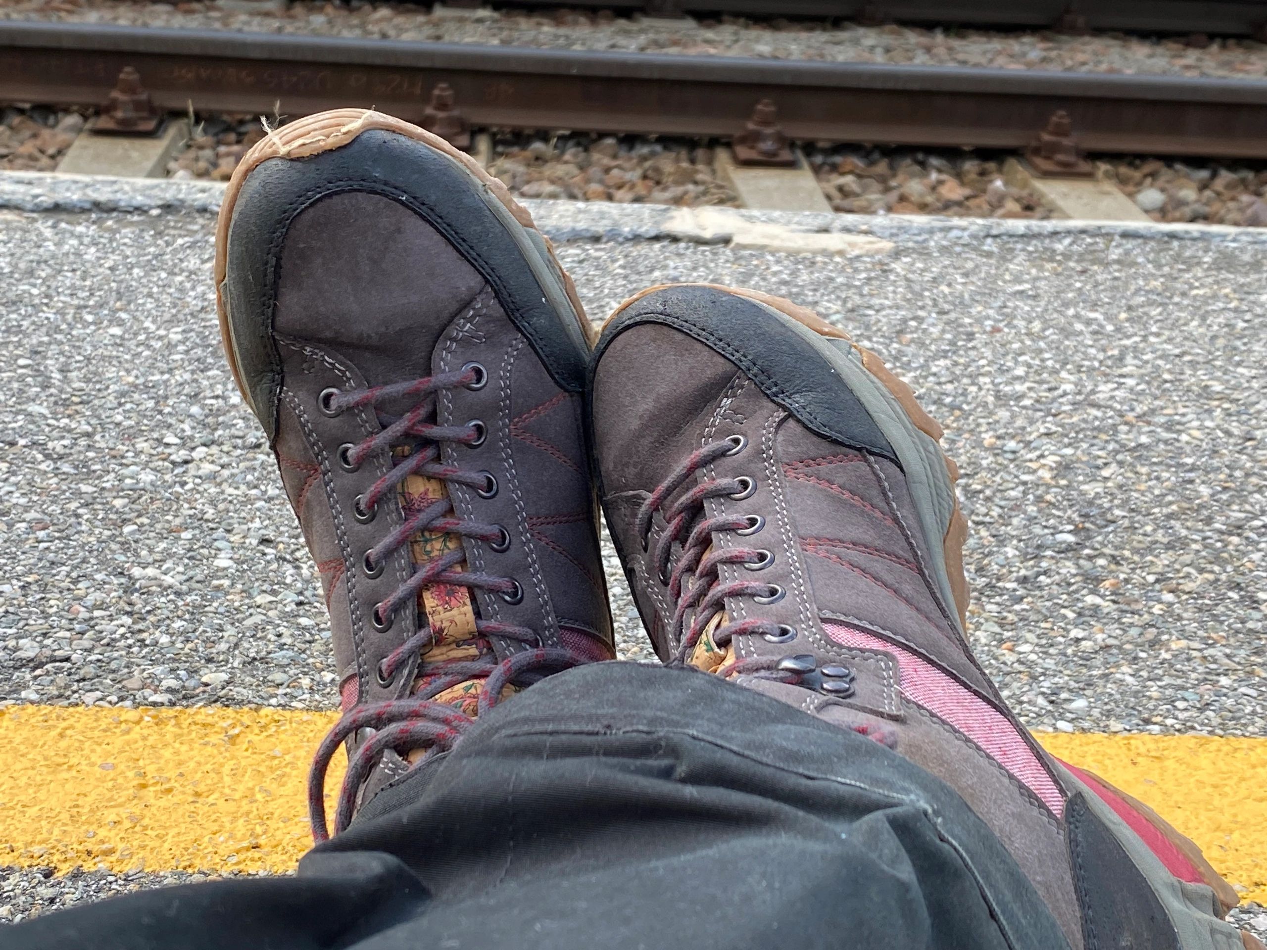 Minimalist travel shoes on railway