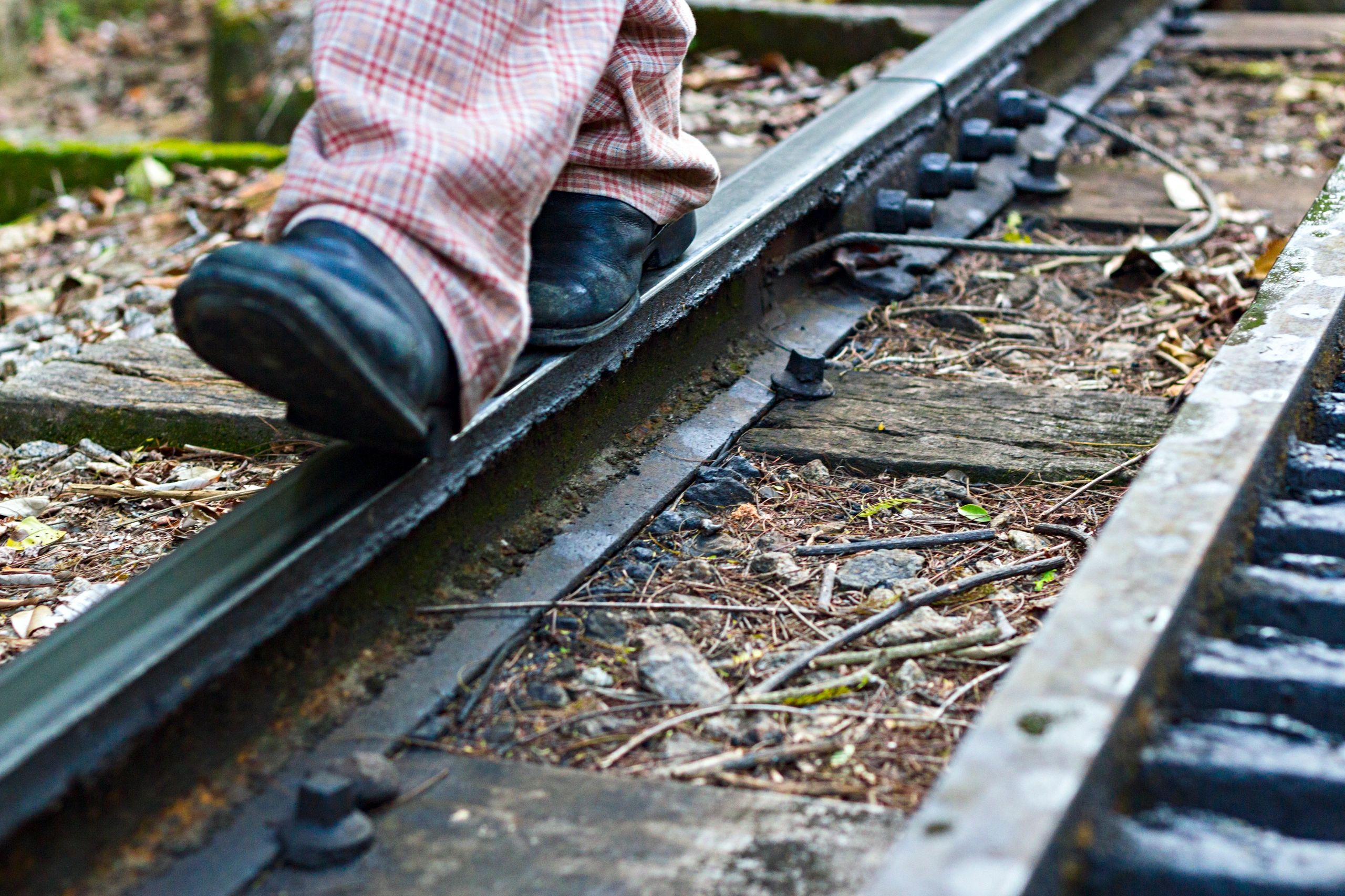 Minimalist travel shoes on railway
